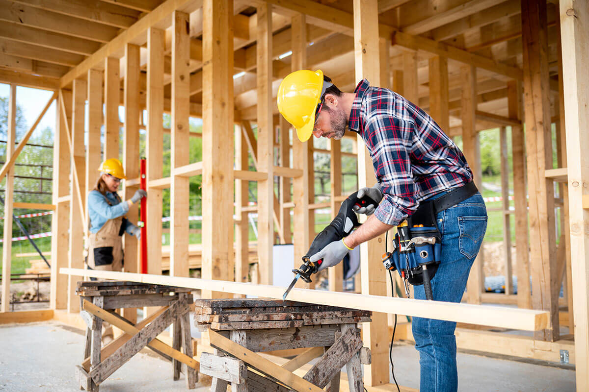 team-of-workers-doing-woodwork-at-construction-sit