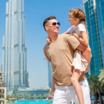 happy-family-walking-in-dubai-with-skyscrapers