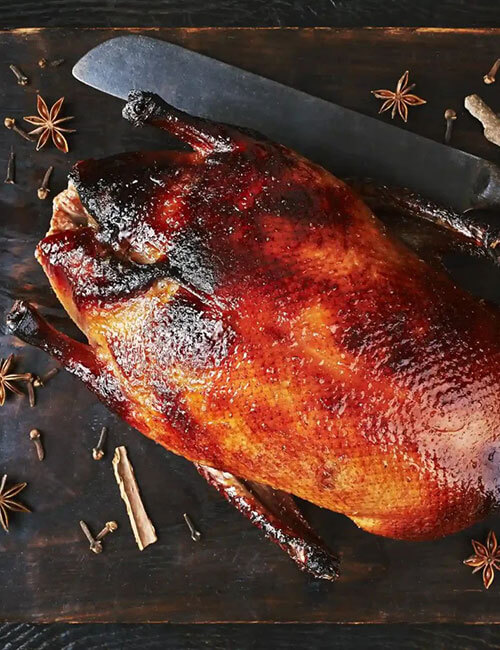 still-life-with-peking-duck-on-cutting-board-over